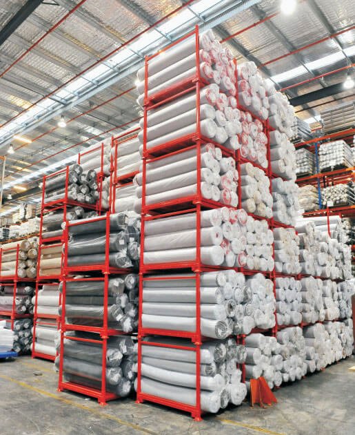 Stacked shelves for fabric rolls in the warehouse