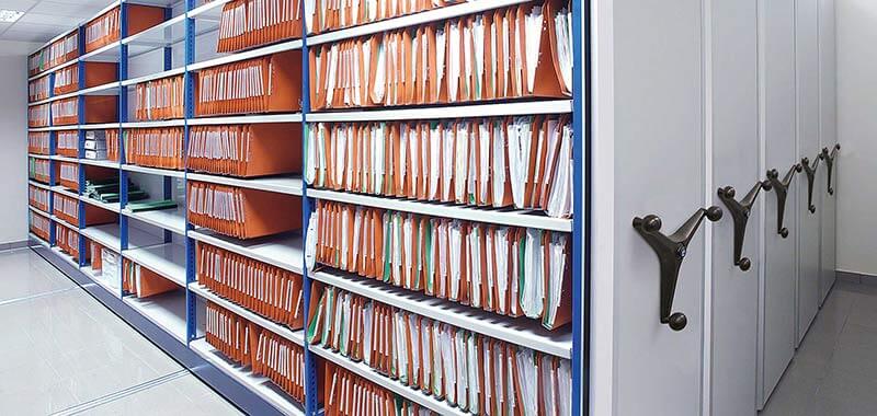 Automatic sliding storage shelves hold files